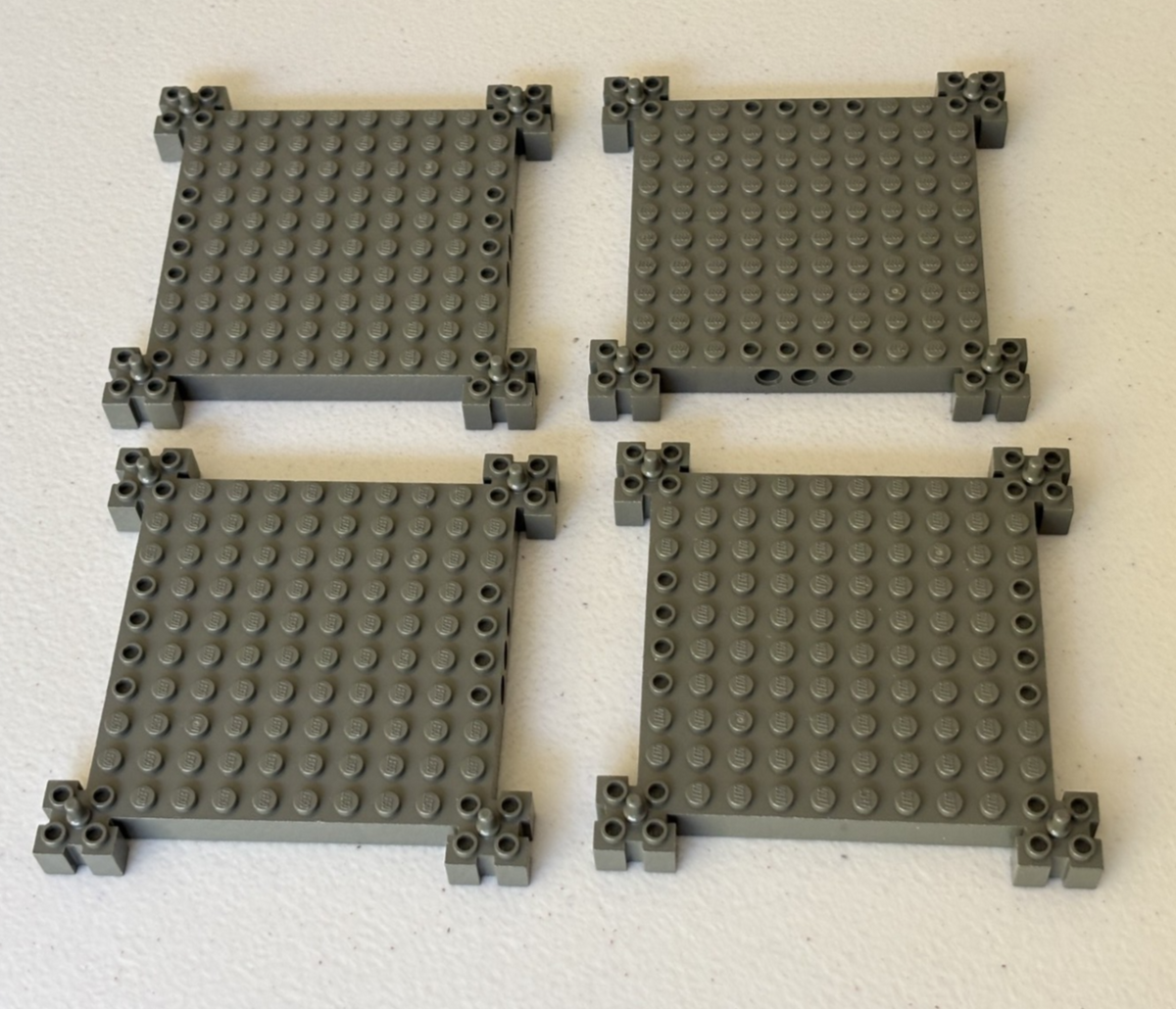 LEGO 4 Pieces Old Dark Gray Brick Thick base with peg at corners 12x12 30645